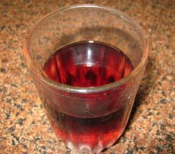 A glass of rhubarb wine